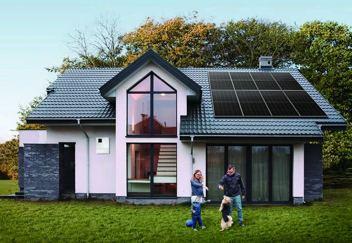 Family outside a home with rooftop solar panels